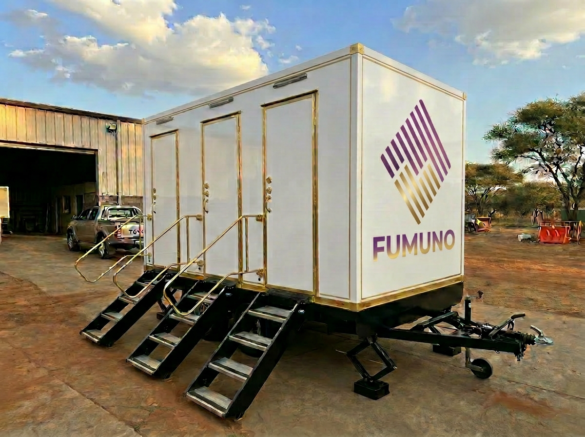 Luxury executive portable toilet trailer interior with granite counter and gold taps